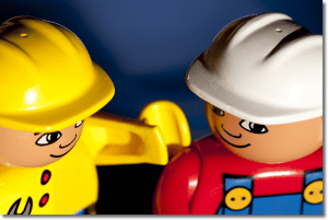 Two lego workers looking convivial