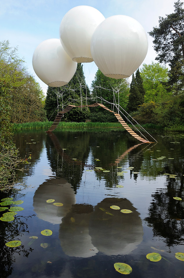 A bridge supported by balloons.